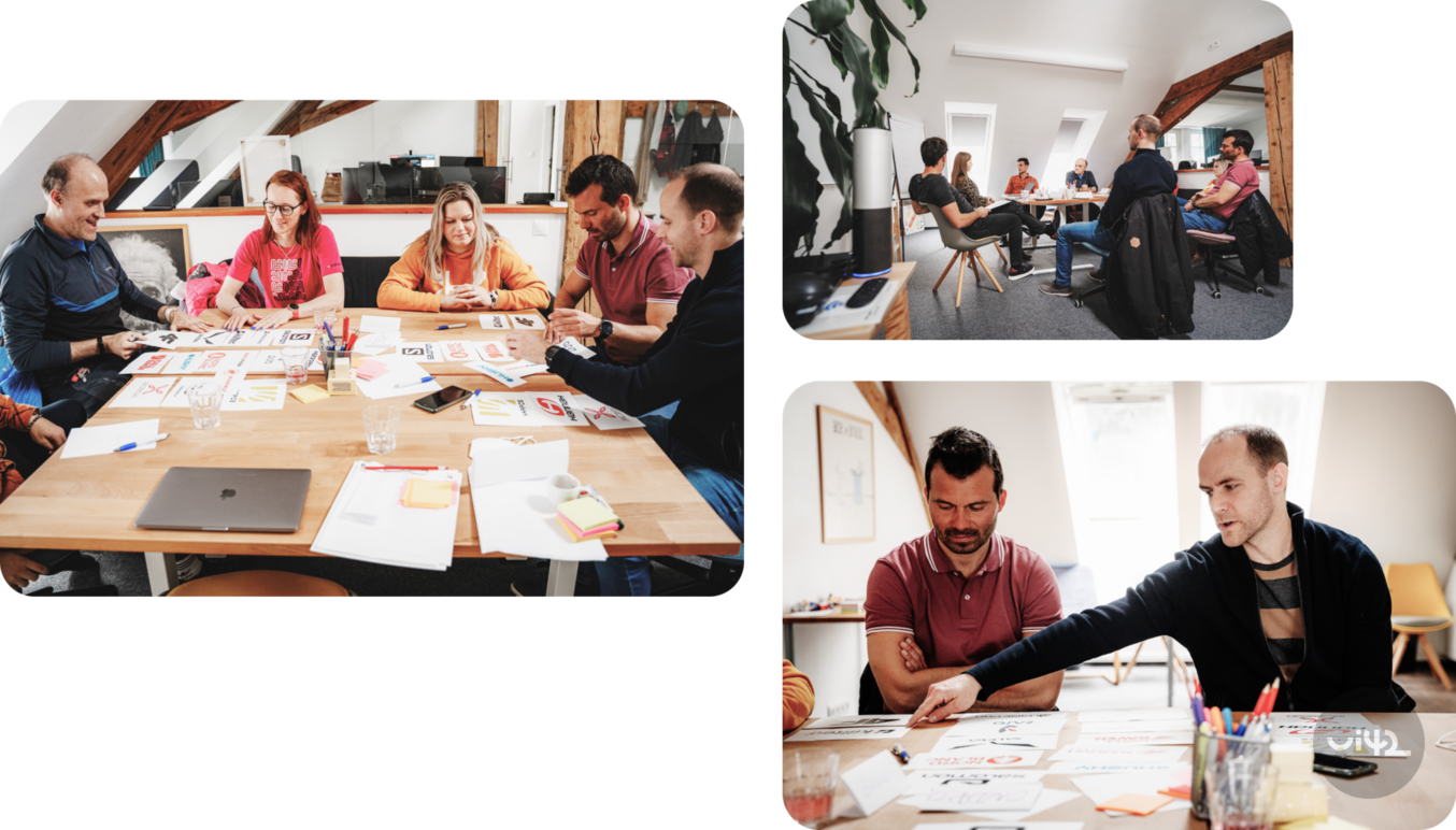 Workshop v kanceláři, kde skupina lidí sedí kolem stolu, diskutuje a pracuje s různými materiály a grafikami. Další záběry ukazují účastníky během diskuse a setkání v místnosti a detailní zobrazení některých účastníků při práci.